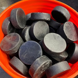 25 Used Ice Hockey Pucks
