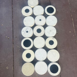 Ice Hockey Goalie White Pucks and White Pucks With Black Dots