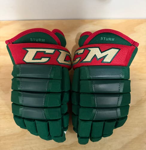 Used Nico Sturm Minnesota Wild ccm hg97 green and red gloves size 14