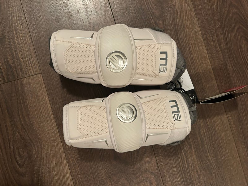 New white Melrick lacrosse, elbow pads large