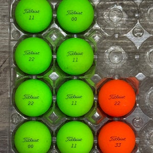 10 Titleist Velocity Golf Ball - Green and Orange Color