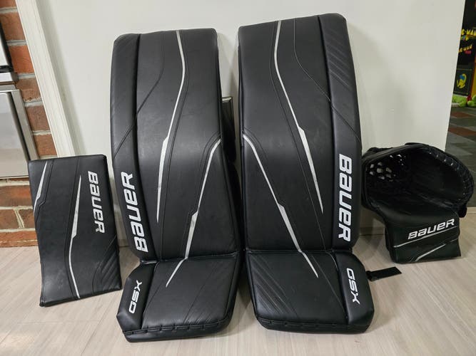 31+ Bauer GSX Intermediate Black Leg Pads, Regular Goalie Glove and Blocker (Used)