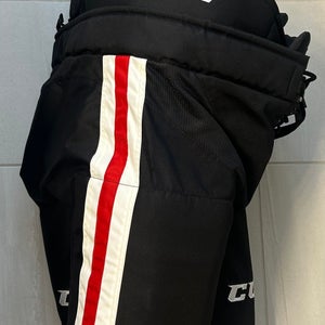 Senior Large CCM HP32 black with red white stripe Hockey Pants Pro Stock (Used)