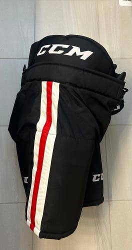 Senior Large CCM HP32 black with red white stripe Hockey Pants Pro Stock (Used)