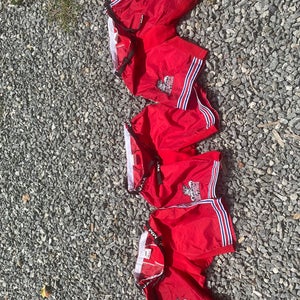 Red  Hartford Jr Wolfpack Small  and medium three  Pant Shells price of one.  (Used)