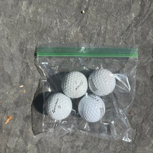 4 pack of professional practice golf balls (Used)