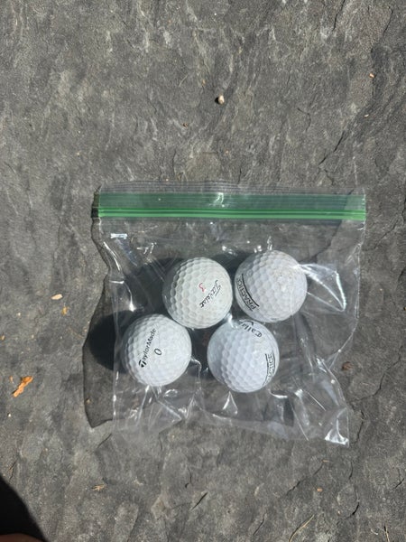 4 pack of professional practice golf balls (Used)