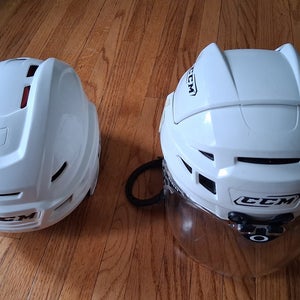 2 Medium hockey CCM white Helmets: Vector V10 and Resistance (Used)