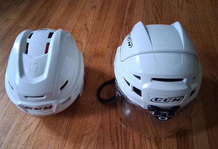 2 Medium hockey CCM white Helmets: Vector V10 and Resistance (Used)