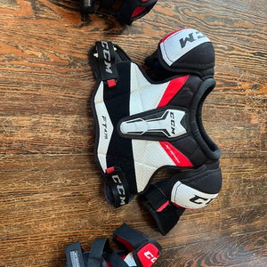 CCM Starter Kit (Used) junior medium shoulder pads and elbow pads.