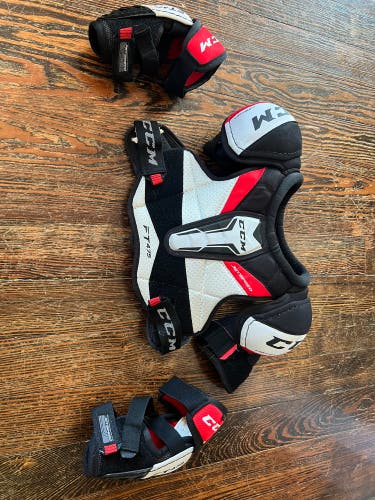 CCM Starter Kit (Used) junior medium shoulder pads and elbow pads.
