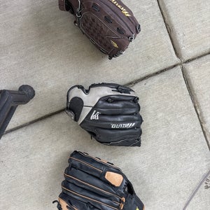 3 Baseball Gloves. (2 Mizuno, 1 Wilson)