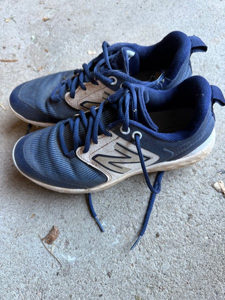New Balance molded cleats big kid size 5