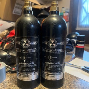 2 refillable Pure Energy 20 oz CO2 paintball tanks that are empty (Used)