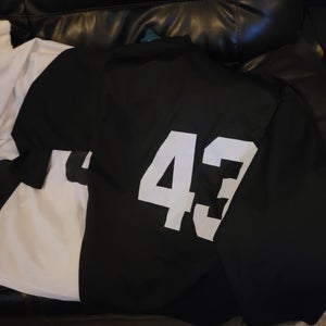 Matching set of black/white jerseys