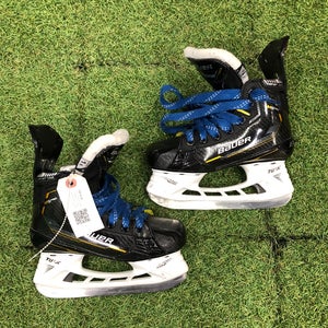 Junior Bauer Supreme M5 Pro Hockey Skates Regular Width Size 1.5 (Used)