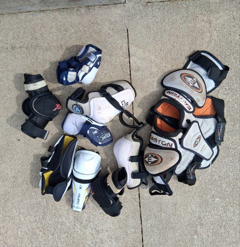 Bundle of 8 various junior hockey items: elbow pads, shoulder pads, shin pads