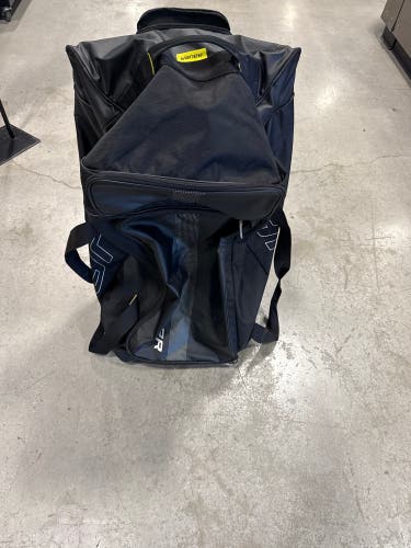 Black Bauer Wheeled Equipment Bag (Used) | 34”x 20”x 12”