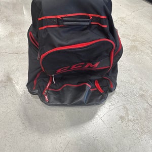 Black & Red CCM Wheeled Equipment Backpack (Used) | 26” x 18” x 12”
