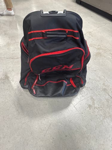 Black & Red CCM Wheeled Equipment Backpack (Used) | 26” x 18” x 12”