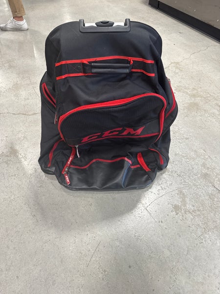 Black & Red CCM Wheeled Equipment Backpack (Used) | 26” x 18” x 12”