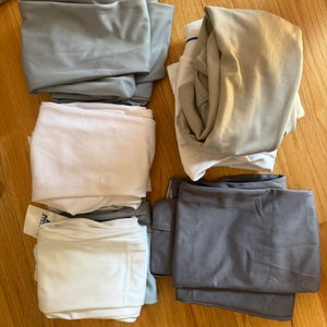 Set of 9 large baseball pants, 2 NEW, 1 barely worn, others good shape