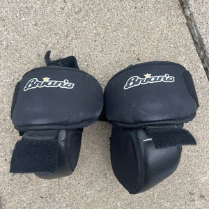 Junior Brians hockey goalie knee pads. Velcro into some pads.