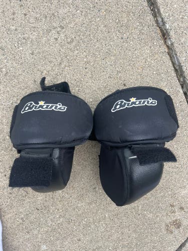 Junior Brians hockey goalie knee pads. Velcro into some pads.