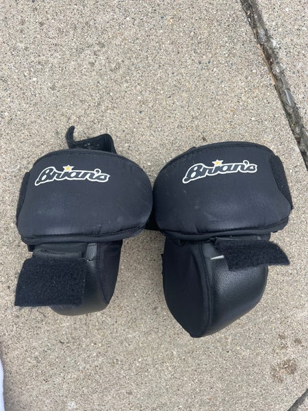 Junior Brians hockey goalie knee pads. Velcro into some pads.