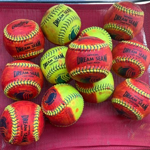 One Dozen - Rawlings Dream Seam (Used) 11” 1/2 colored red leather softballs for pitcher training