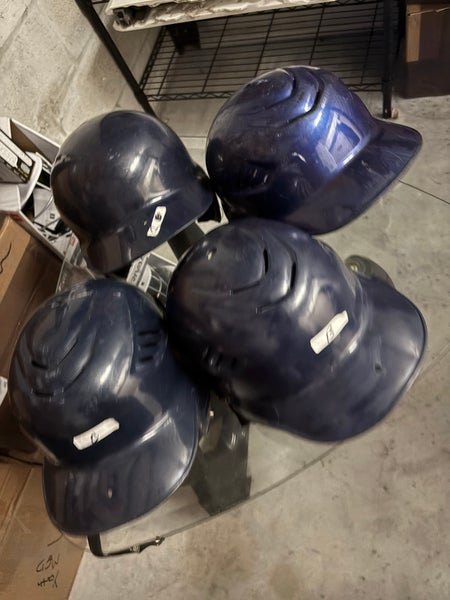 Lot of four used youth batting helmets for baseball