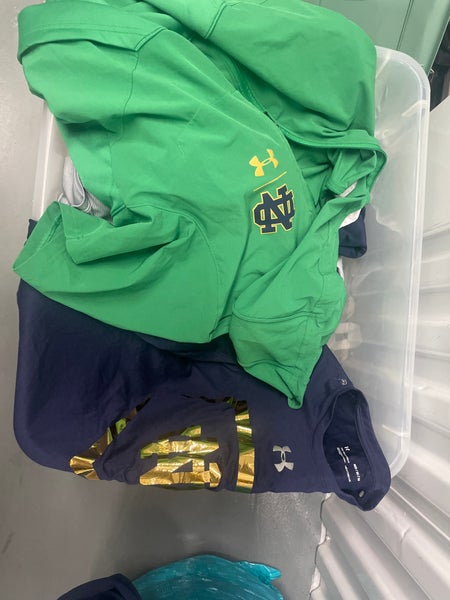 Box of Notre Dame gear short sleeve long sleeve polos hoodies UA in great condition