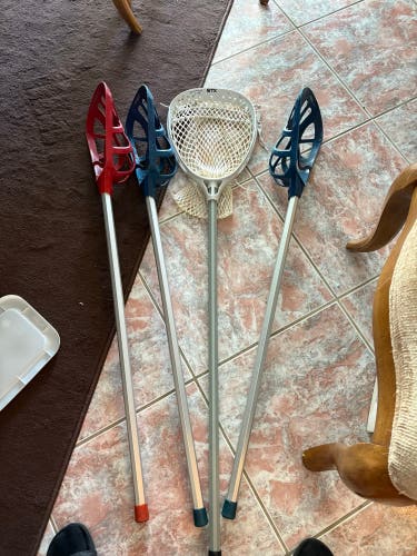 Bunch of mini fiddle lacrosse sticks