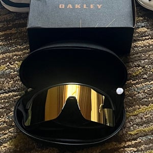Black Oakley sutro lite with Gold lense