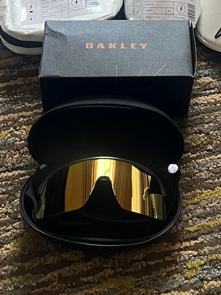 Black Oakley sutro lite with Gold lense