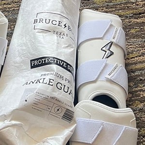 White Bruce bolt Leg guard