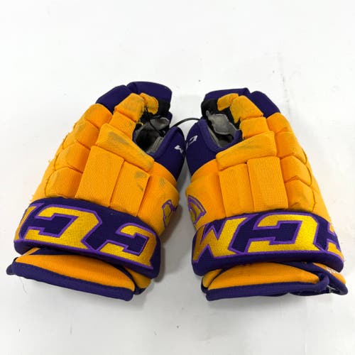Used Yellow and Purple CCM 4 Roll Pro Gloves | 13" | E554