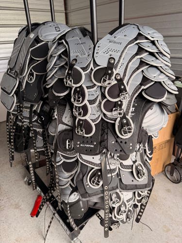 22 Schutt F7 VTD Helmets (2024) + 40 Schutt XV Flux Shoulder Pads (2024) + Racks