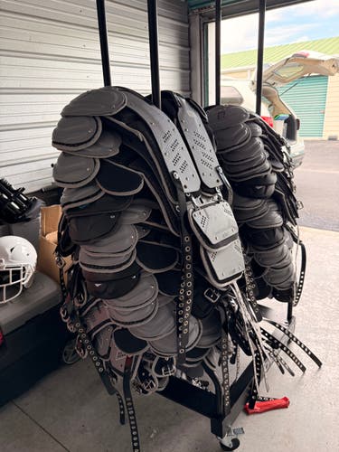 19 Schutt F7 VTD Helmets (2024) + 30 Schutt XV Flux Shoulder Pads (2024) + Racks
