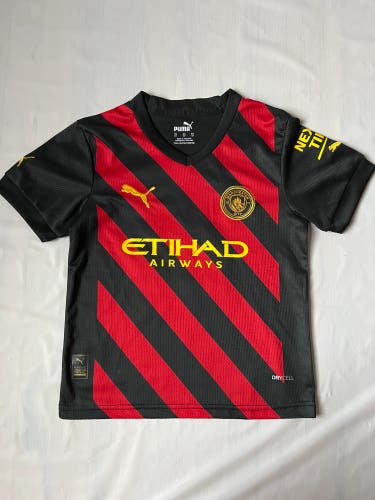Manchester City 2022/23 kid's Puma Away jersey in black tango red drycell 10 Grealish