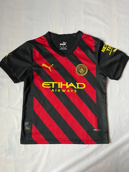 Manchester City 2022/23 kid's Puma Away jersey in black tango red drycell 10 Grealish