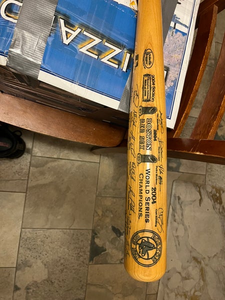 2004 Boston RedSox world Series Champion Louisville Slugger bat. Engraved signatures from all player