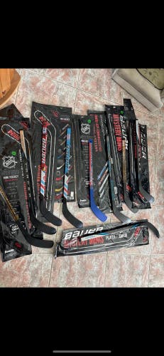 (New) lot of 9 hockey mini sticks