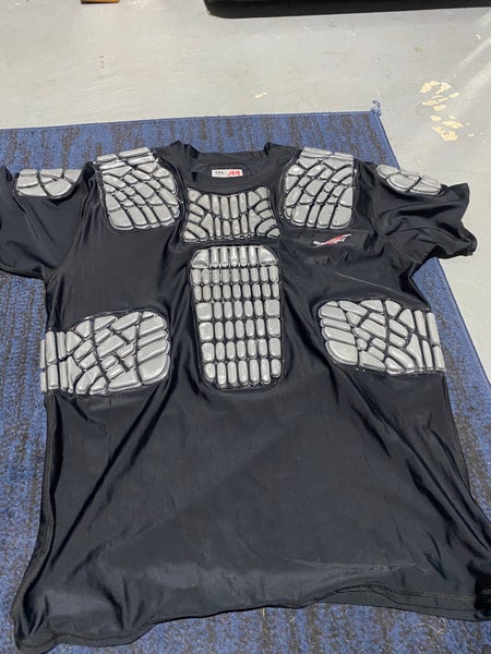 Protective compression shirt for football hockey lacrosse