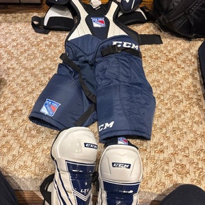 Men's Small Junior CCM Shoulder Pads, Pants, And Shin Guards Bundle.