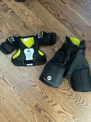 Youth medium Pure Hockey shoulder pads and player shorts