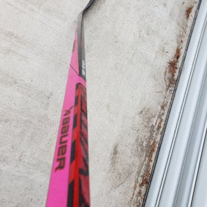 Intermediate pink and sickBauer Twitch Right Handed Hockey Stick P28 (New)