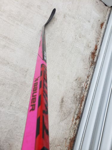 Intermediate pink and sickBauer Twitch Right Handed Hockey Stick P28 (New)