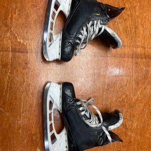 Used Senior Bauer Supreme UltraSonic Hockey Skates Regular Width Pro Stock 8.5 with shot blockers.