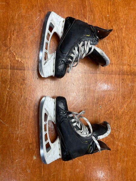 Used Senior Bauer Supreme UltraSonic Hockey Skates Regular Width Pro Stock 8.5 with shot blockers.